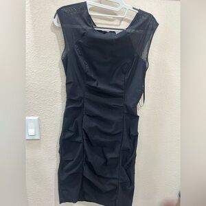 Elegant Pompous Studios black dress with sheer shoulders. Size 8.